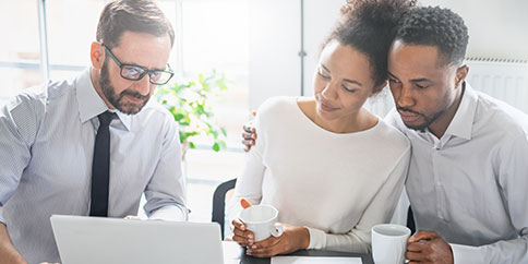 couple speaking to real estate agent