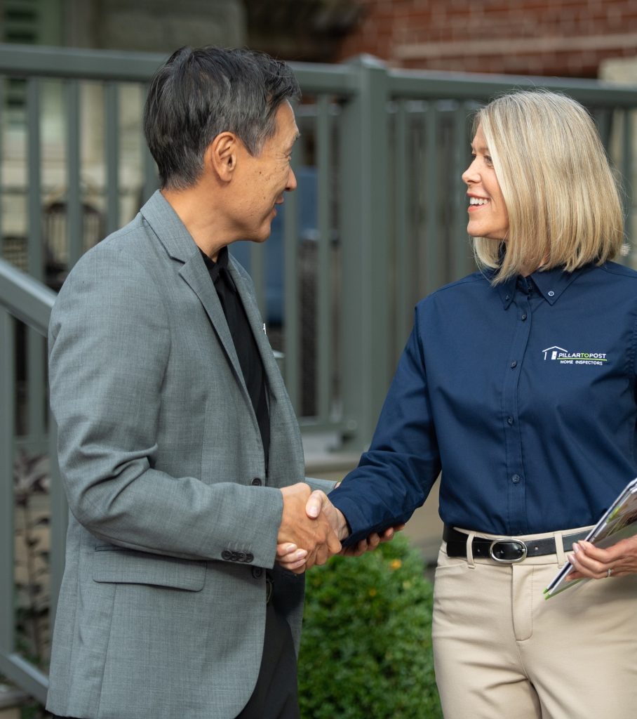 Realtor and Inspector talking and shaking hands